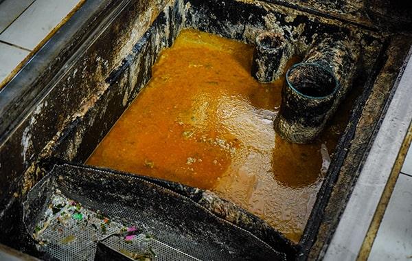 grease trap cleaning helps prevent grease and oil from entering the sewer system, thus reducing the risk of environmental contamination